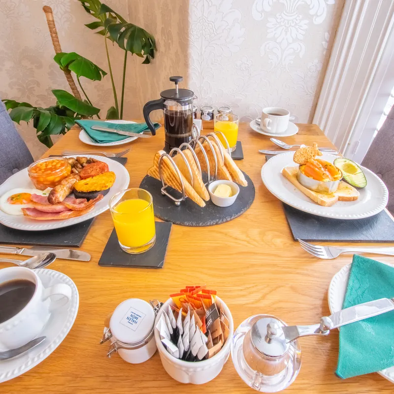 Breakfast for two: a full Welsh and eggs on toast, with toast, coffee and orange juice