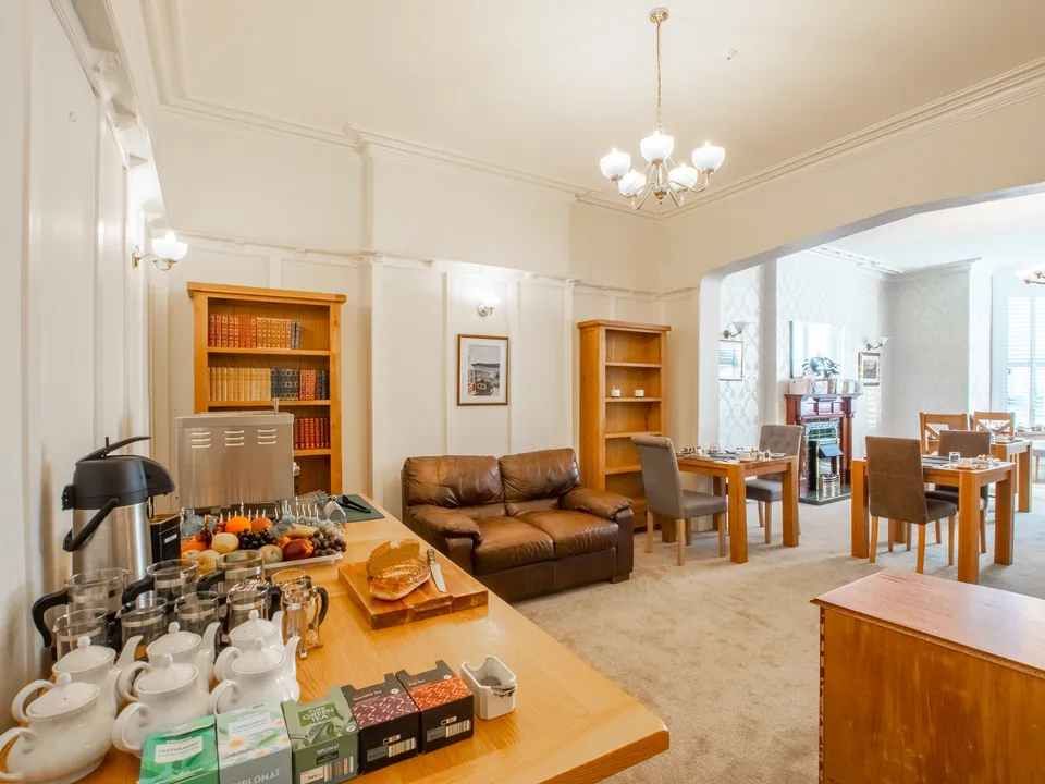 The help-yourself table, with tea and coffee, and the lounge with its leather sofa beyond