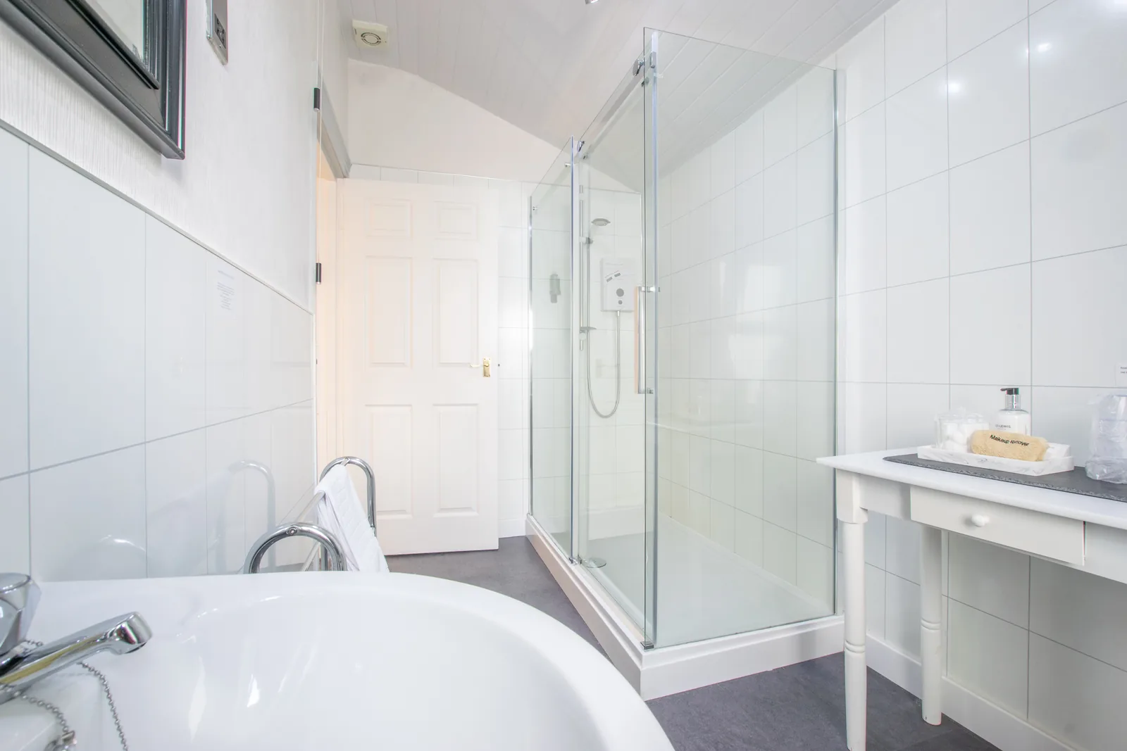 Beaumaris, Room 1: the en-suite, with a bath, a walk-in shower and a white washstand