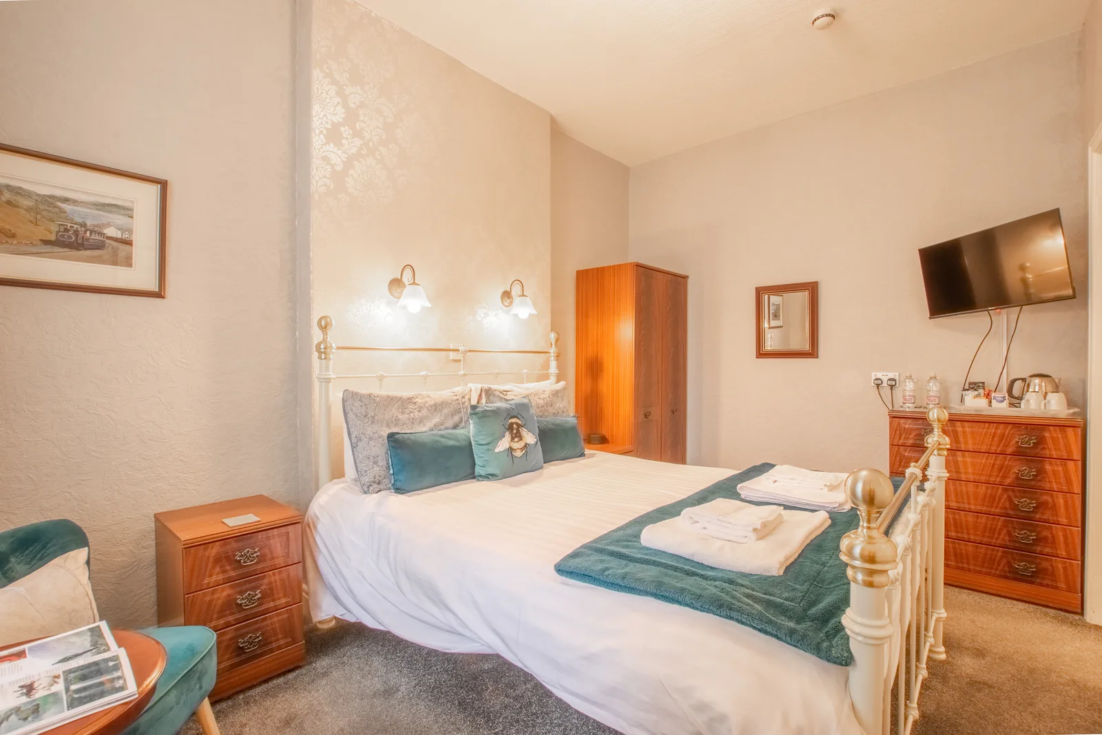 Penrhyn, Room 2: the bed, a wardrobe, a chest of drawers with the tea and coffee tray, and a wall-mounted TV