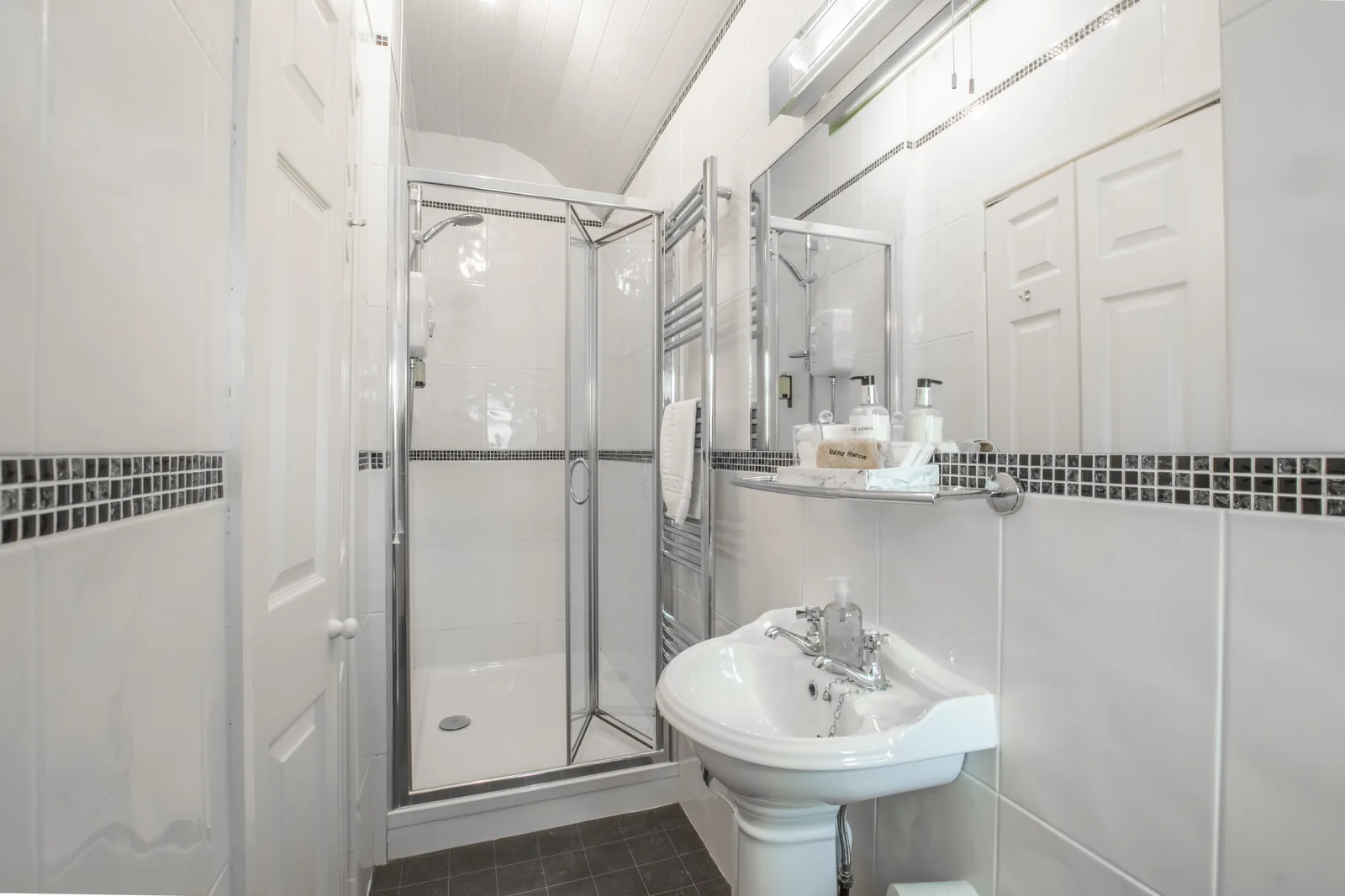 Caernarfon, Room 4: the en-suite, with a shower, basin and heated towel rail