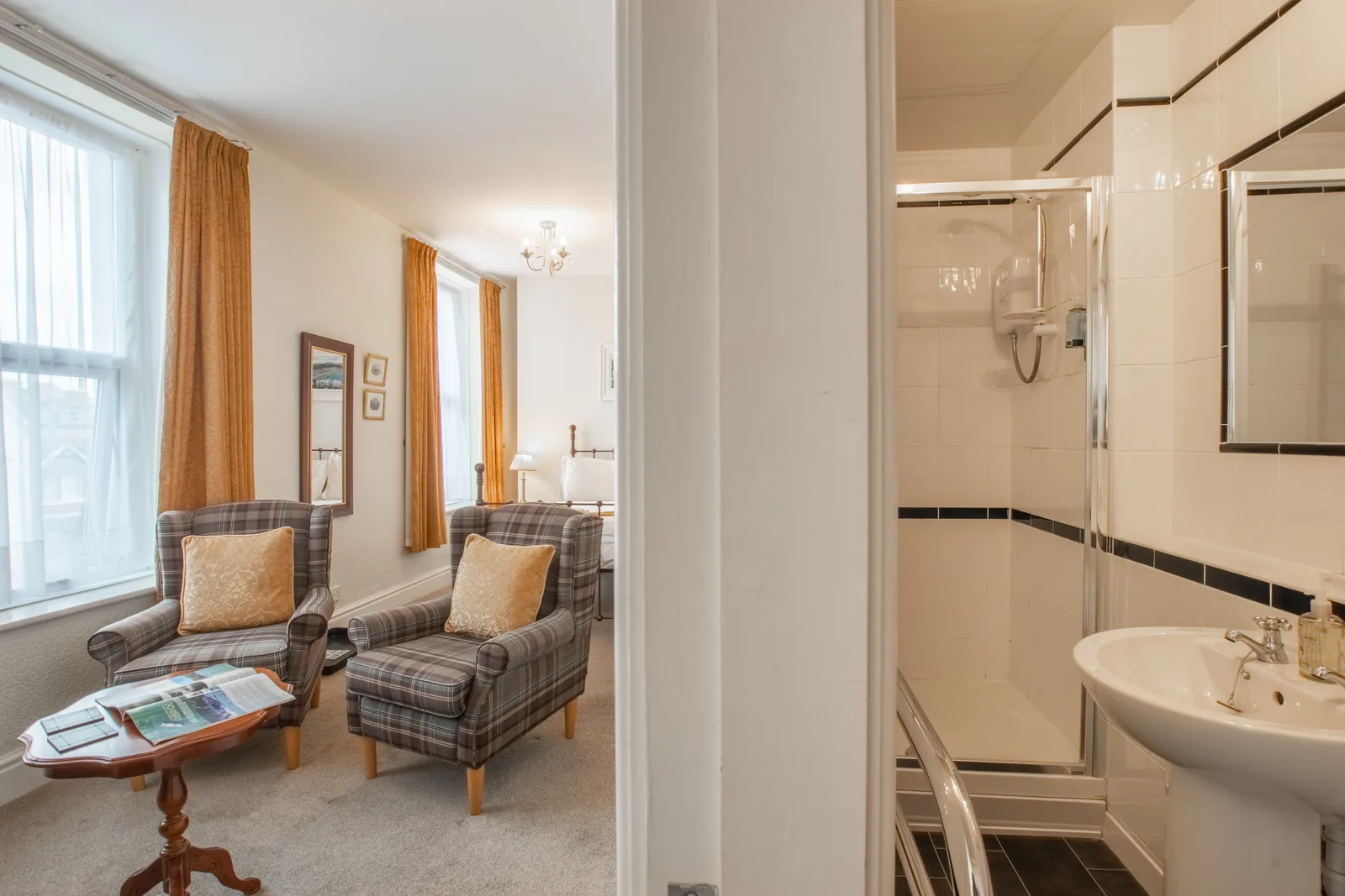 Conwy Studio, Room 6: the sitting area by the window, with the en-suite shower room beside it